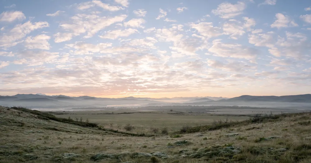 Serene calm sky with soft clouds at dawn