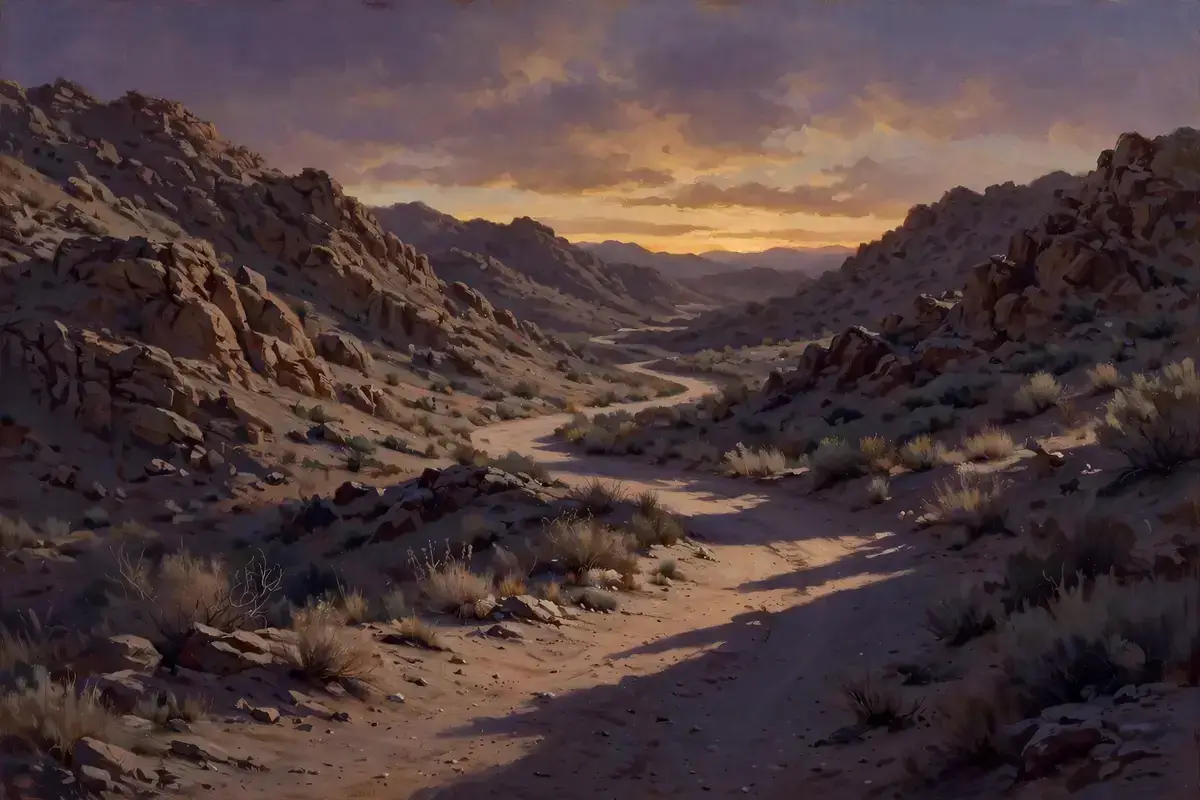 A lone desert path winding between rocky hills at dusk